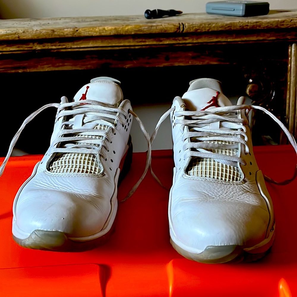 Nike Air Jordan low top golf shoes.